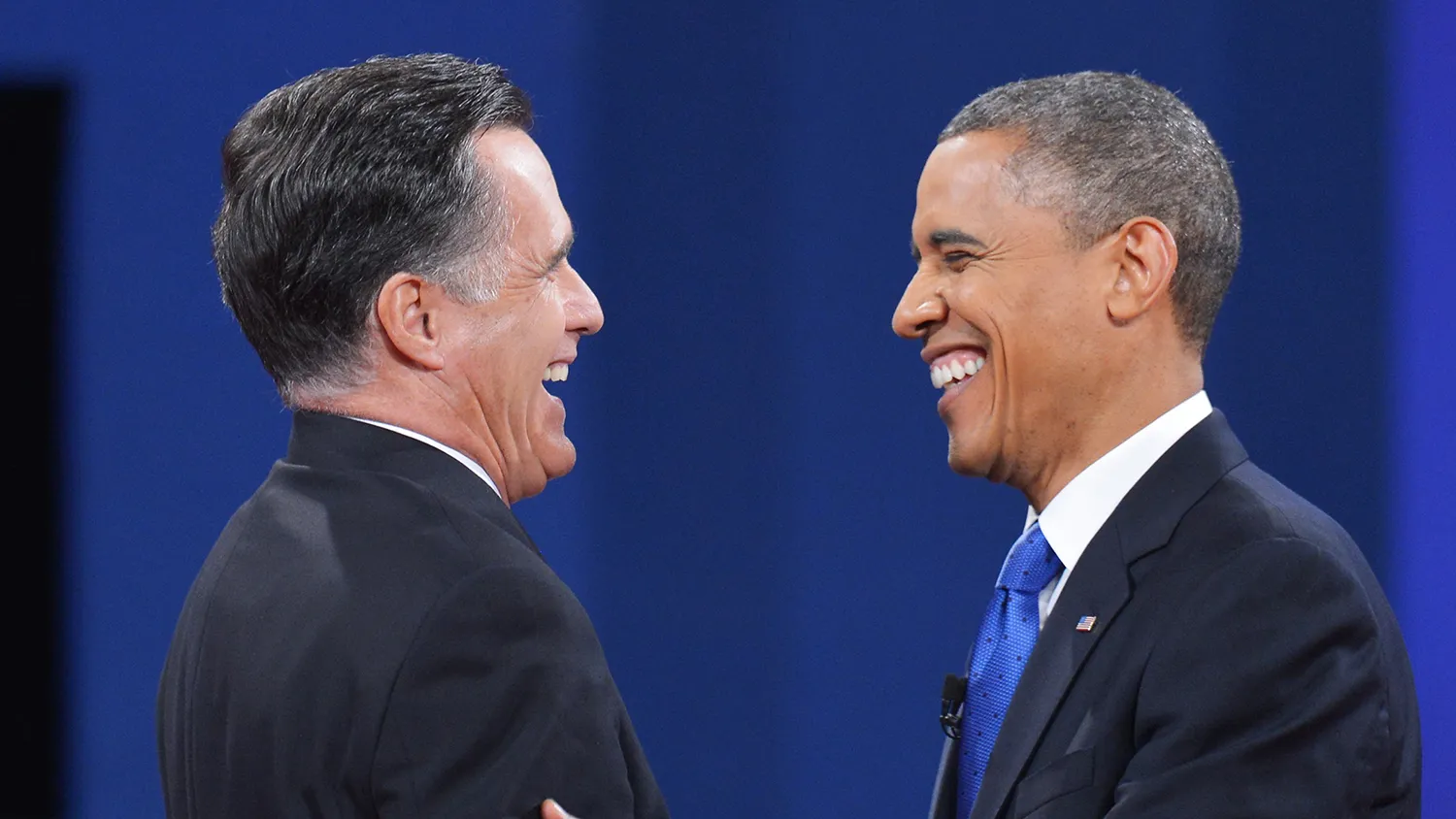US President Barack Obama and Republican presidential candidate Mitt Romney shake hands at the end of the third and final presidential debate October 22, 2012 at Lynn University in Boca Raton, Florida.
