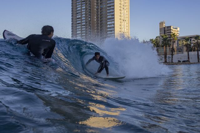 Surfers ride waves inside the surf pool at the Sao Paulo Surf Club. 