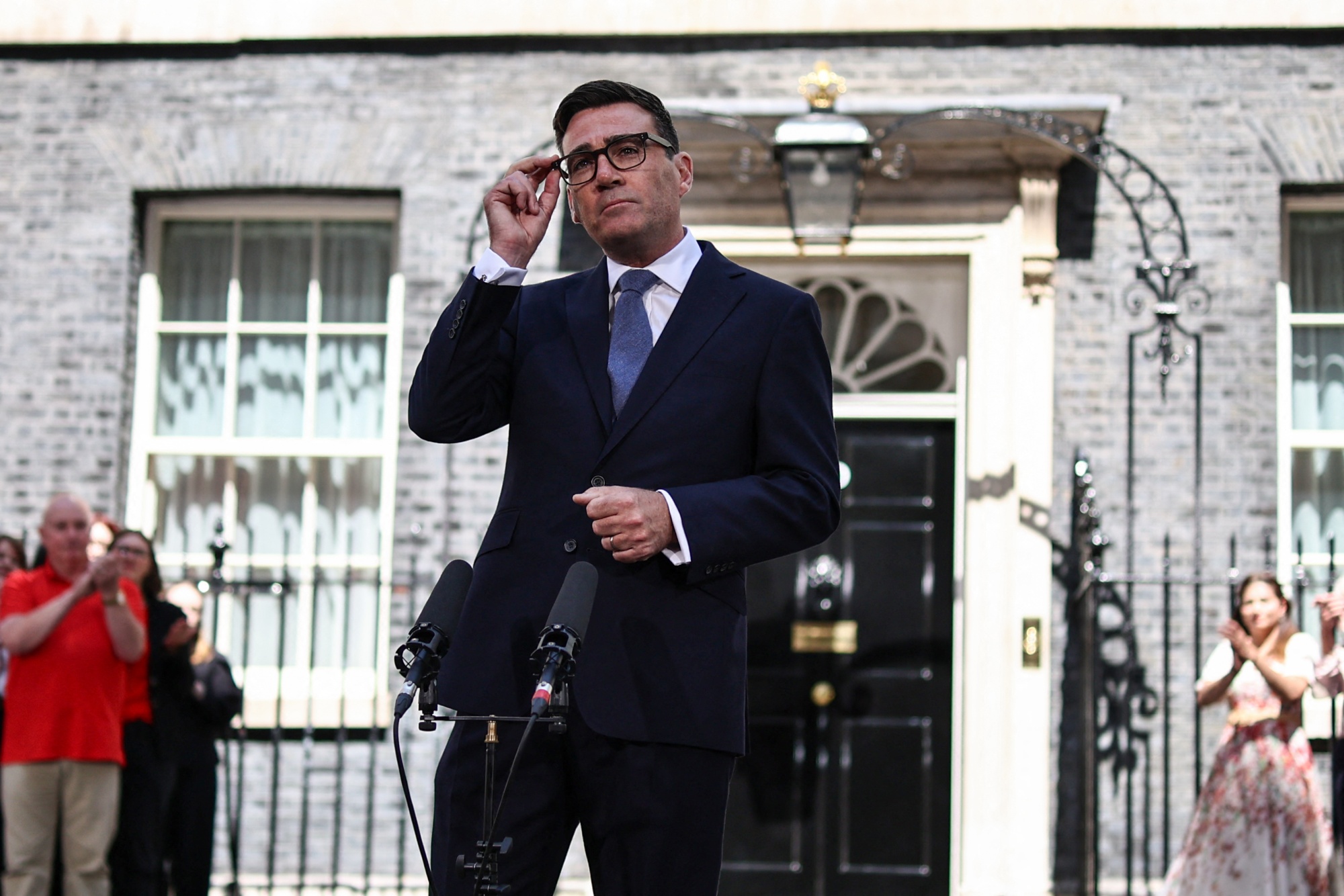 Britain's new Prime Minister Andy Burnham gives his first speech in front of 10 Downing Street in central London on July 20, 2026, after being asked by the king to form the next government. (Photo by Henry Nicholls / AFP via Getty Images) Photographer: HENRY NICHOLLS/AFP
