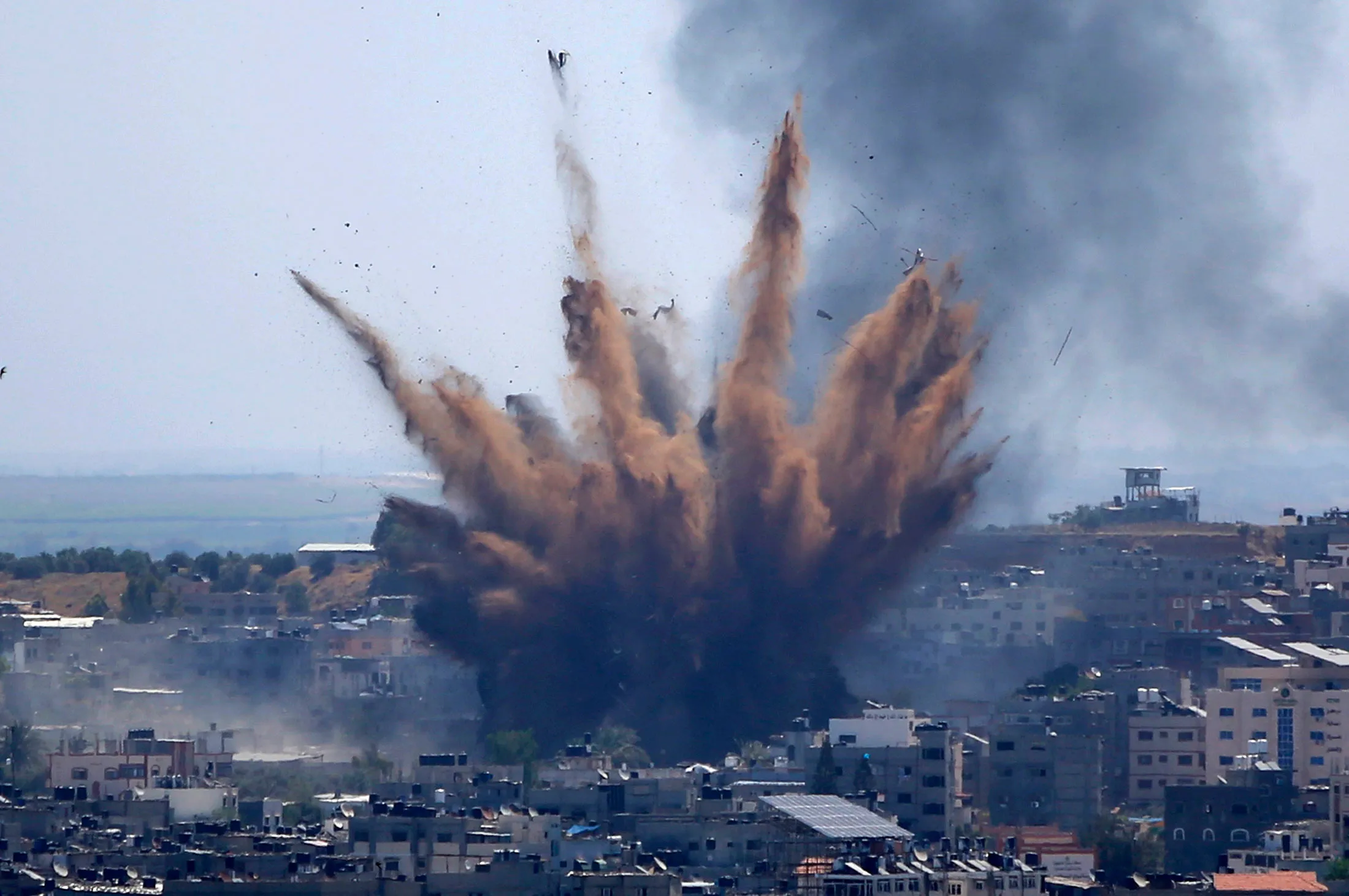 Smoke rises following Israeli airstrikes on a building in Gaza City on May 13.