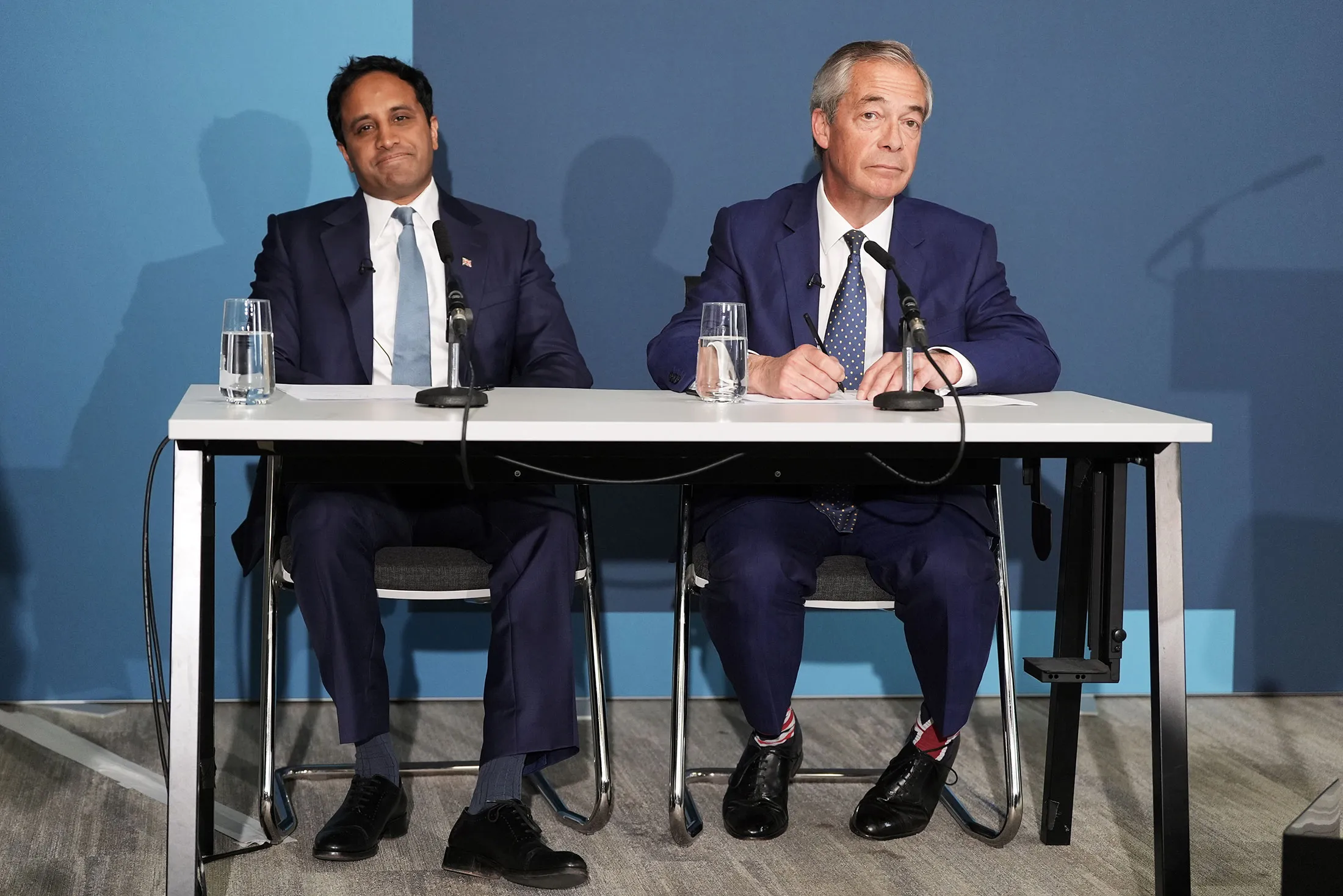 Reform UK home affairs spokesperson Zia Yusuf, left, and Nigel Farage on April 20.