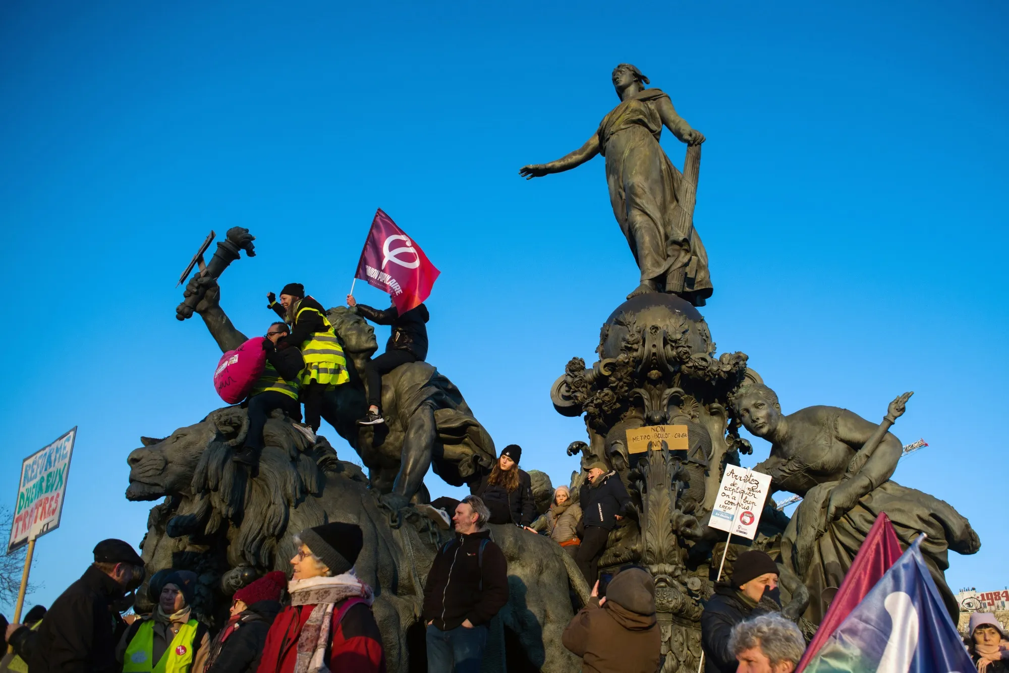 Demonstrators protest against government plans to revamp the pension system, in Paris.