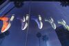 Palm trees are reflected in a Nike Inc. window display outside of the NikeTown Los Angeles retail store in Beverly Hills, California, U.S.