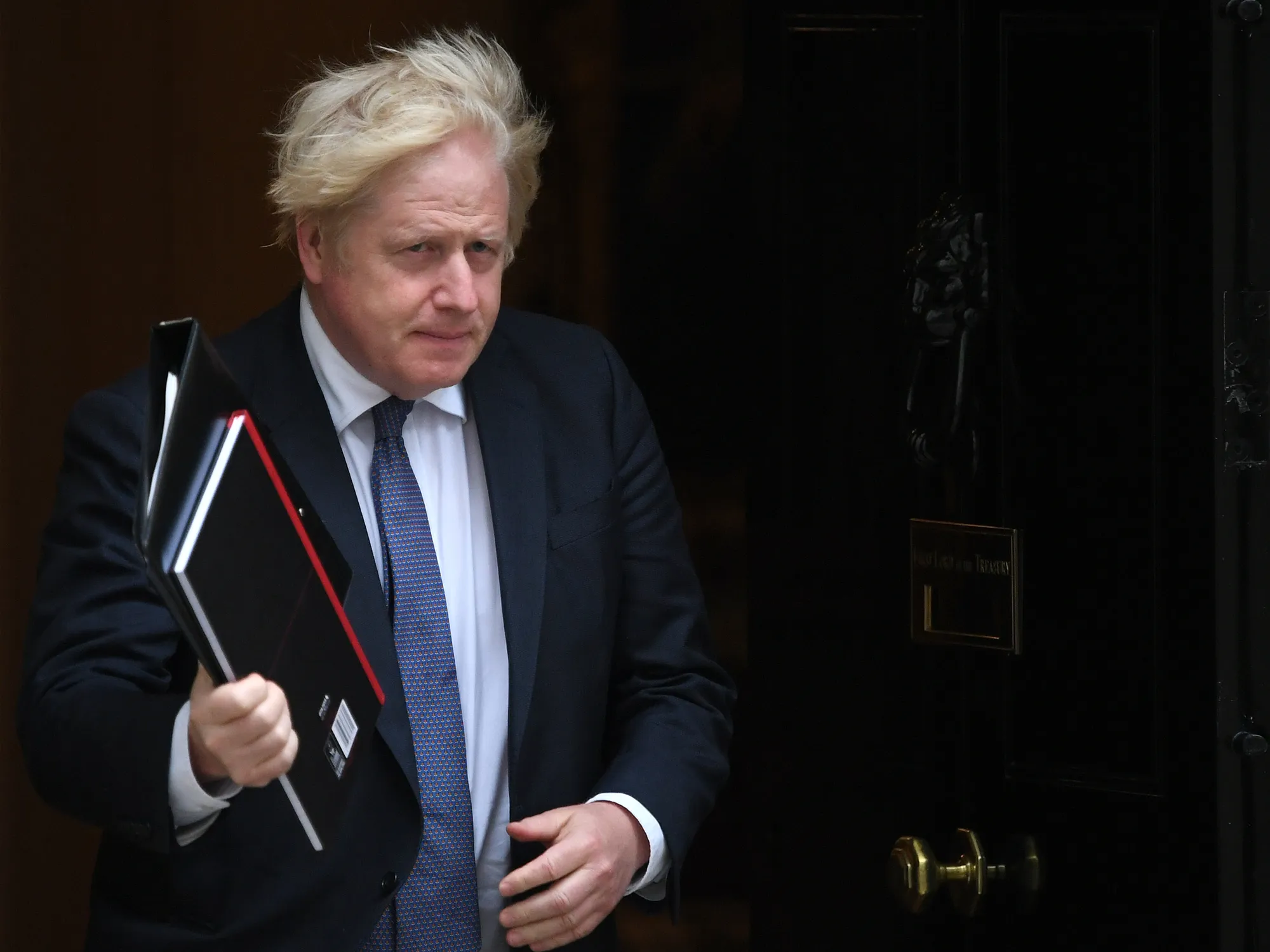 Boris Johnson leaves Downing Street to attend Parliament on Aug. 18.