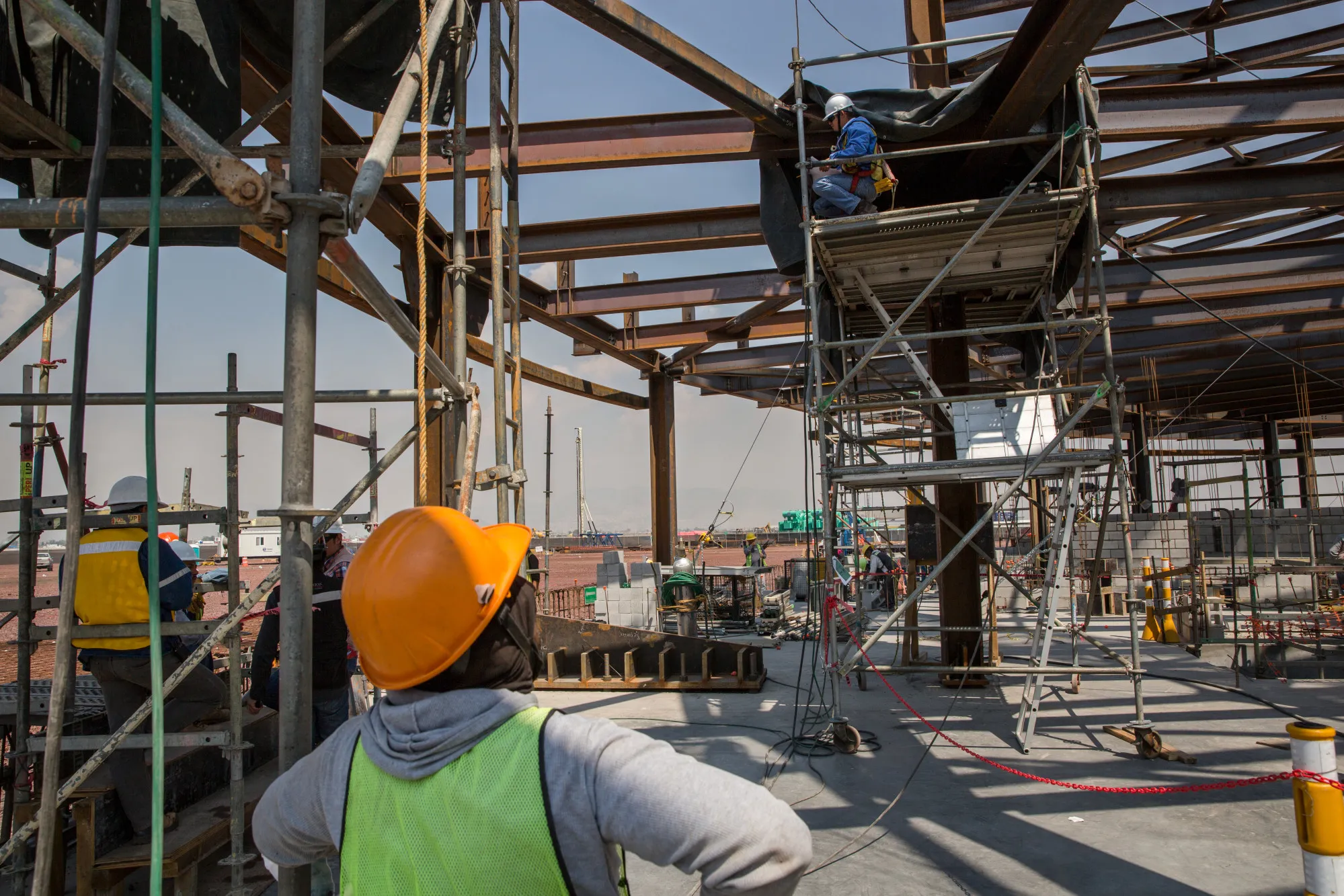 Workers build the flight control tower of the New International Airport of Mexico City during construction in Texcoco on April 13, 2018.