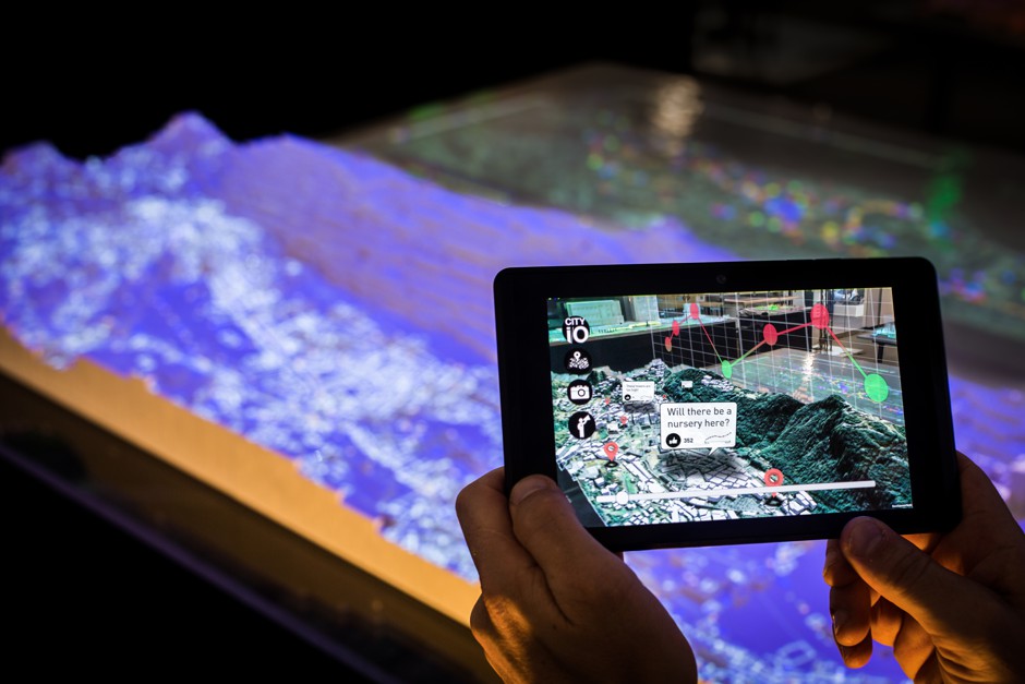An augmented reality view of a city being used as an urban planning tool from MIT Media Lab.