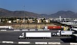 Trucks from Mexico enter a U.S. Customs and Border Protection&nbsp;inspection station at the Otay Mesa Port of Entry in San Diego.