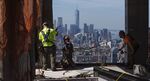 Iron contractors work on the facade of a luxury condominium&nbsp;in New York.
