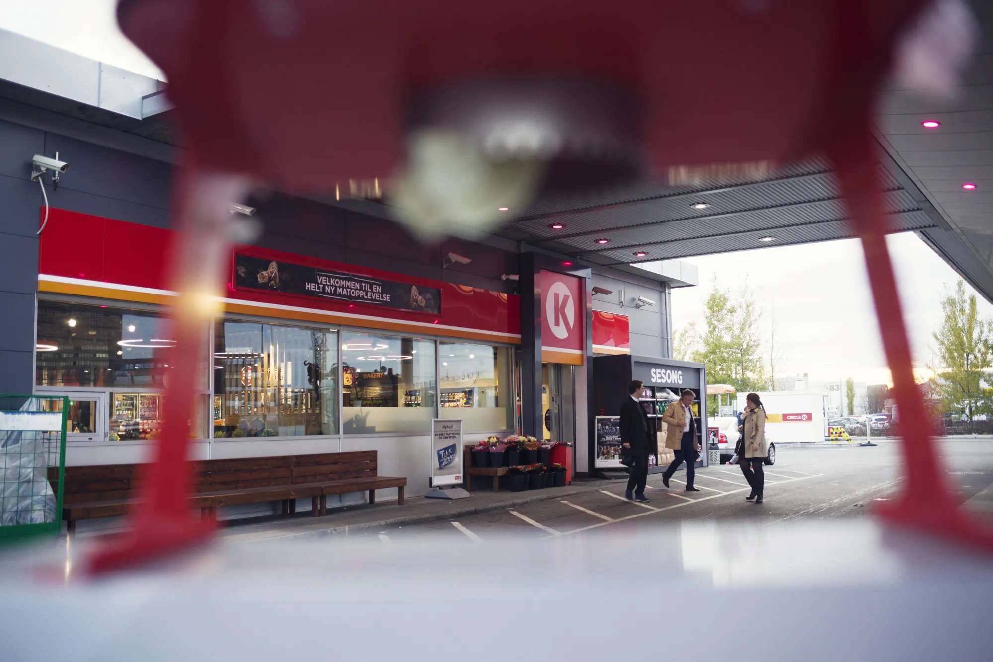 Customers exit the store at a Circle K gas station, operated by Alimentation Couche-Tard Inc., in the Oekern district of Oslo, Norway, on Tuesday, Oct. 31, 2017. Couche-Tard is using the Nordic country as a testing ground for how to respond to the electric-vehicle boom.