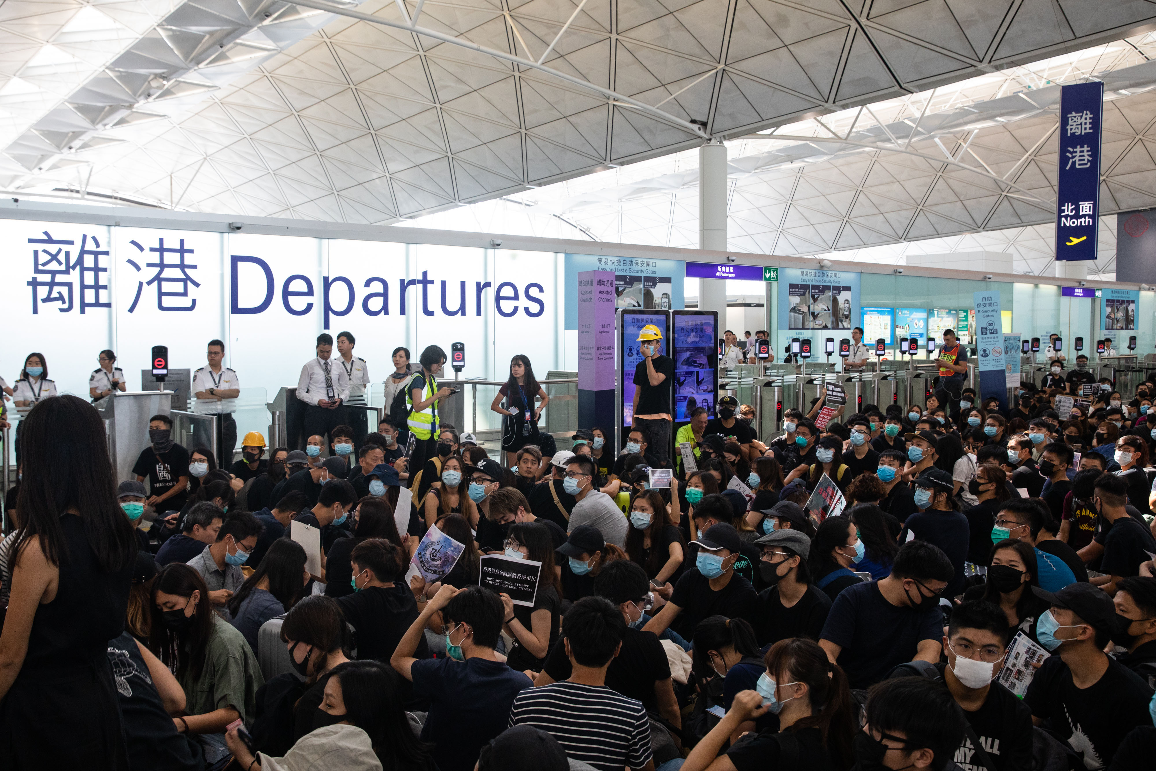 Demonstrators block the terminal one departures hall during a protest at the Hong Kong International Airport on Aug. 13.
