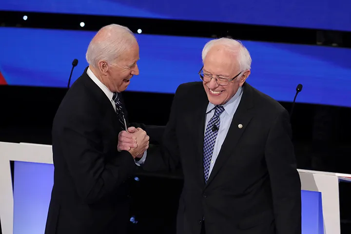 Joe Biden, left, greets&nbsp;Bernie Sanders before the Democratic presidential primary debate in Des Moines, Iowa&nbsp;on Jan. 14.