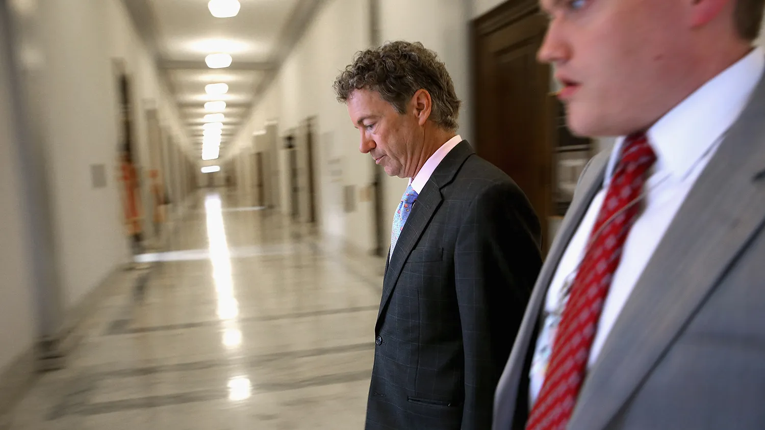 U.S. Sen. Rand Paul (R-KY) heads back to his office after two television interviews in the Russell Senate Office Building on Capitol Hill June 1, 2015 in Washington, DC.

