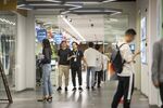 Employees walk through the Ant Group Co. headquarters in Hangzhou, China, on Monday, Sept. 28, 2020.