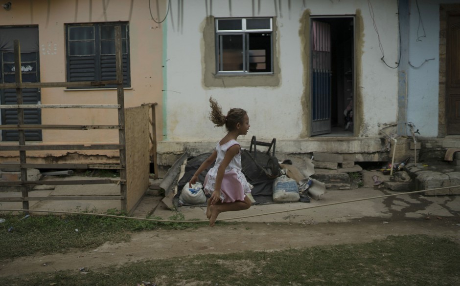 A girl jumps rope in the City of God slum in Rio de Janeiro, one of several global cities profiled in Michael Ignatieff's new book, &quot;The Ordinary Virtues.&quot;