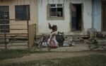 A girl jumps rope in the City of God slum in Rio de Janeiro, one of several global cities profiled in Michael Ignatieff's new book, "The Ordinary Virtues."