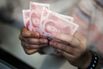 China Fires a Warning Shot at Yuan Speculators With Bank Bans