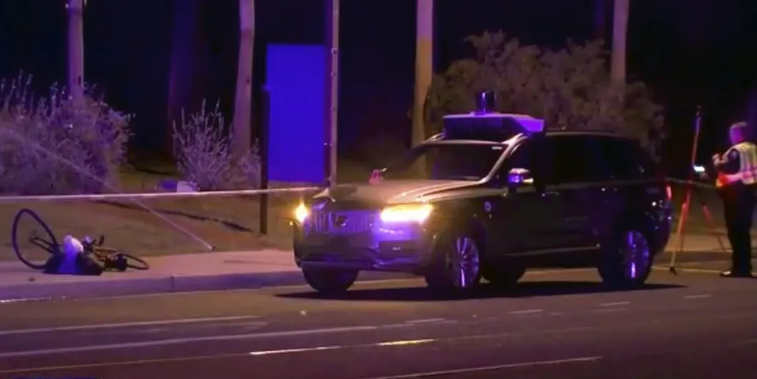 A still image taken from video, shows investigators at the scene of the accident involving an Uber car in Arizona, on March 19.