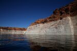 A tall bleached 'bathtub ring' is visible on the rocky banks of Lake Powell in Page, Arizona, on March 29, 2015. Photographer: Justin Sullivan/Getty Images
