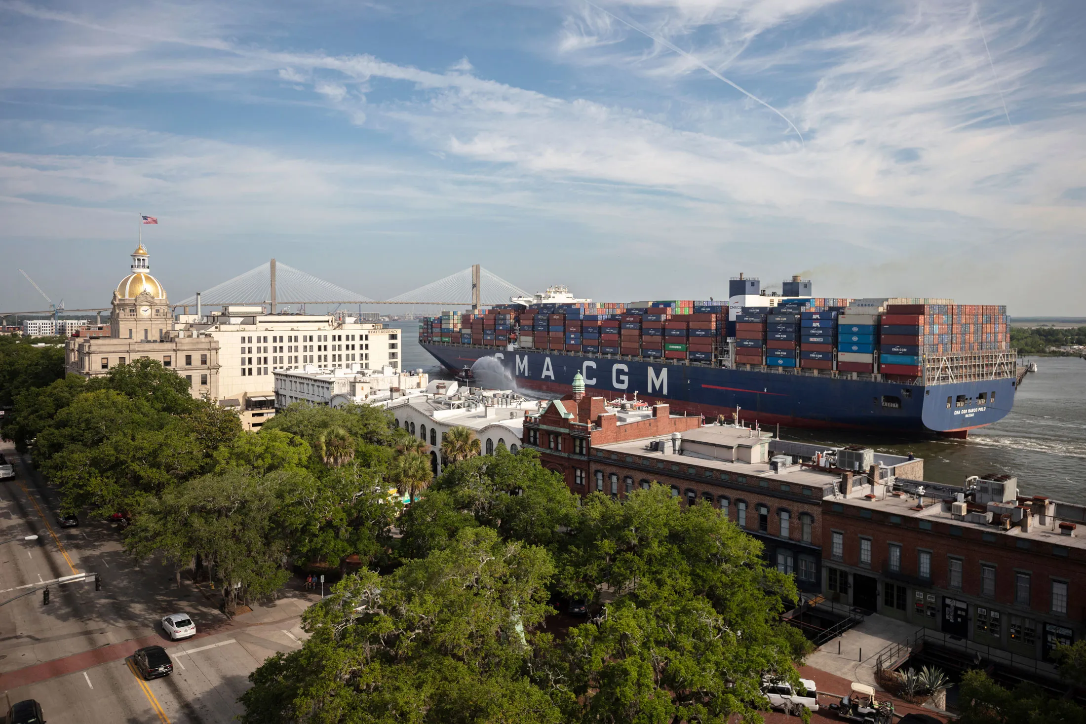 The container ship CMA CGM Marco Polo sails&nbsp;past historic River Street and City Hall in Savannah, Georgia, in 2021.