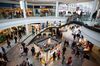 Shoppers walk through the Menlo Park Mall in Edison, New Jersey, U.S., on Friday, Nov. 25, 2016. As Black Friday ushers in the year-end shopping rush, chains are touting larger price cuts than in 2015 -- a gamble that maintaining market share is worth squeezing margins.