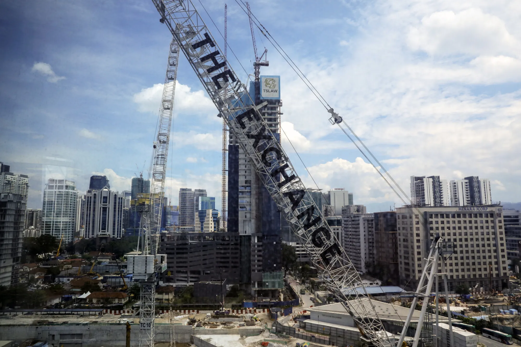 Cranes operate at the under construction Tun Razak Exchange (TRX) financial district in Kuala Lumpur.