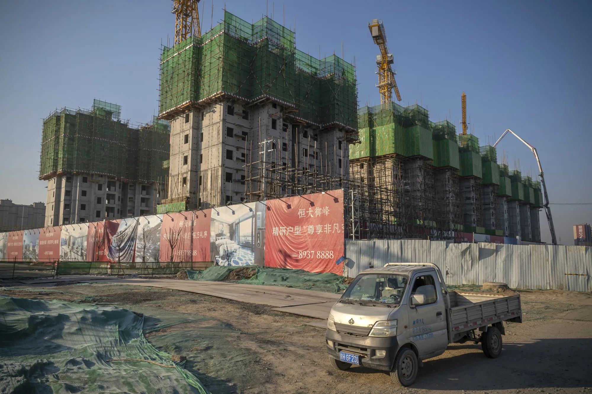 Unfinished apartment buildings at the construction site of a China Evergrande Group development in Beijing.