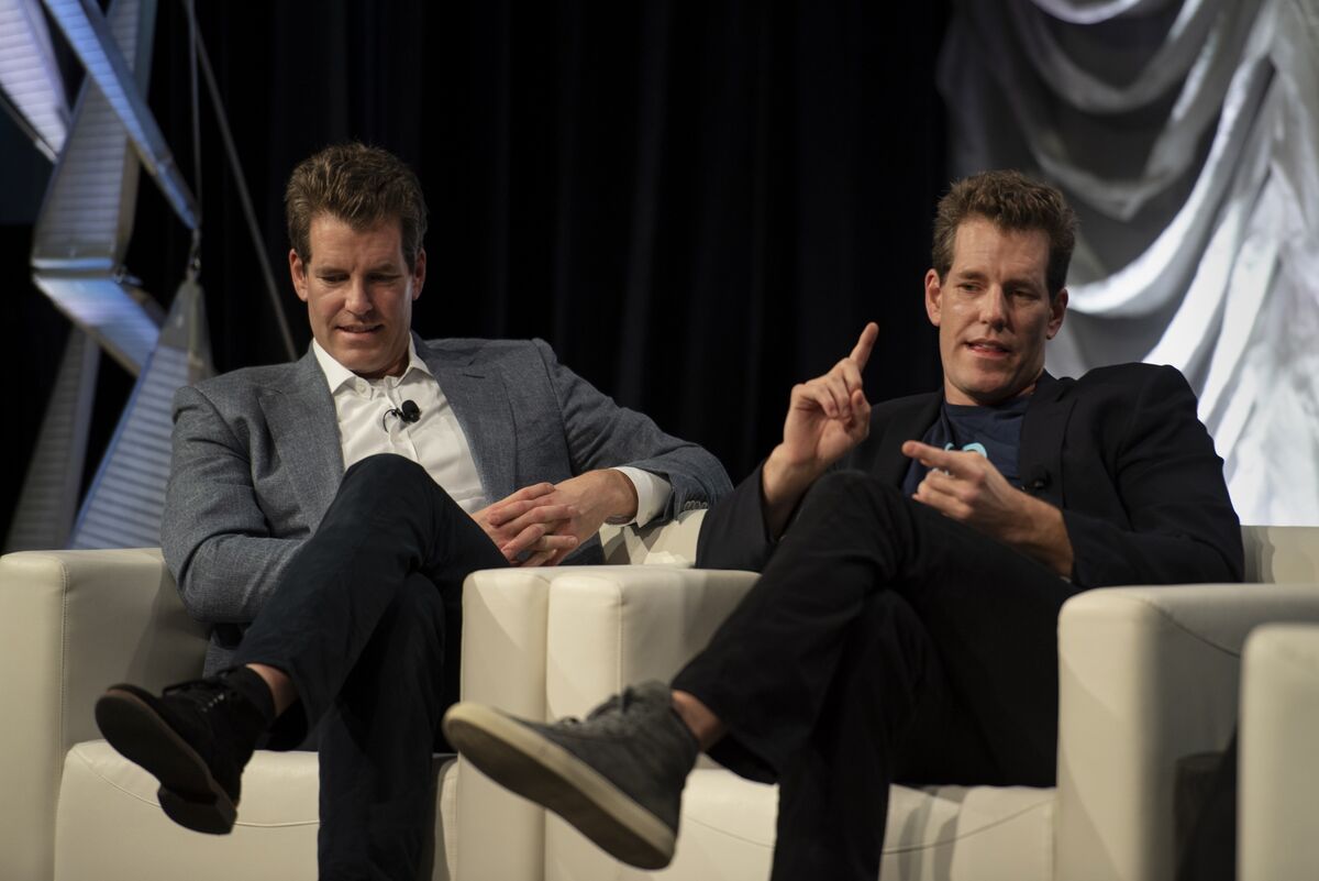 Winklevoss Faithful Have a $700 Million Problem in Genesis Halt - Bloomberg