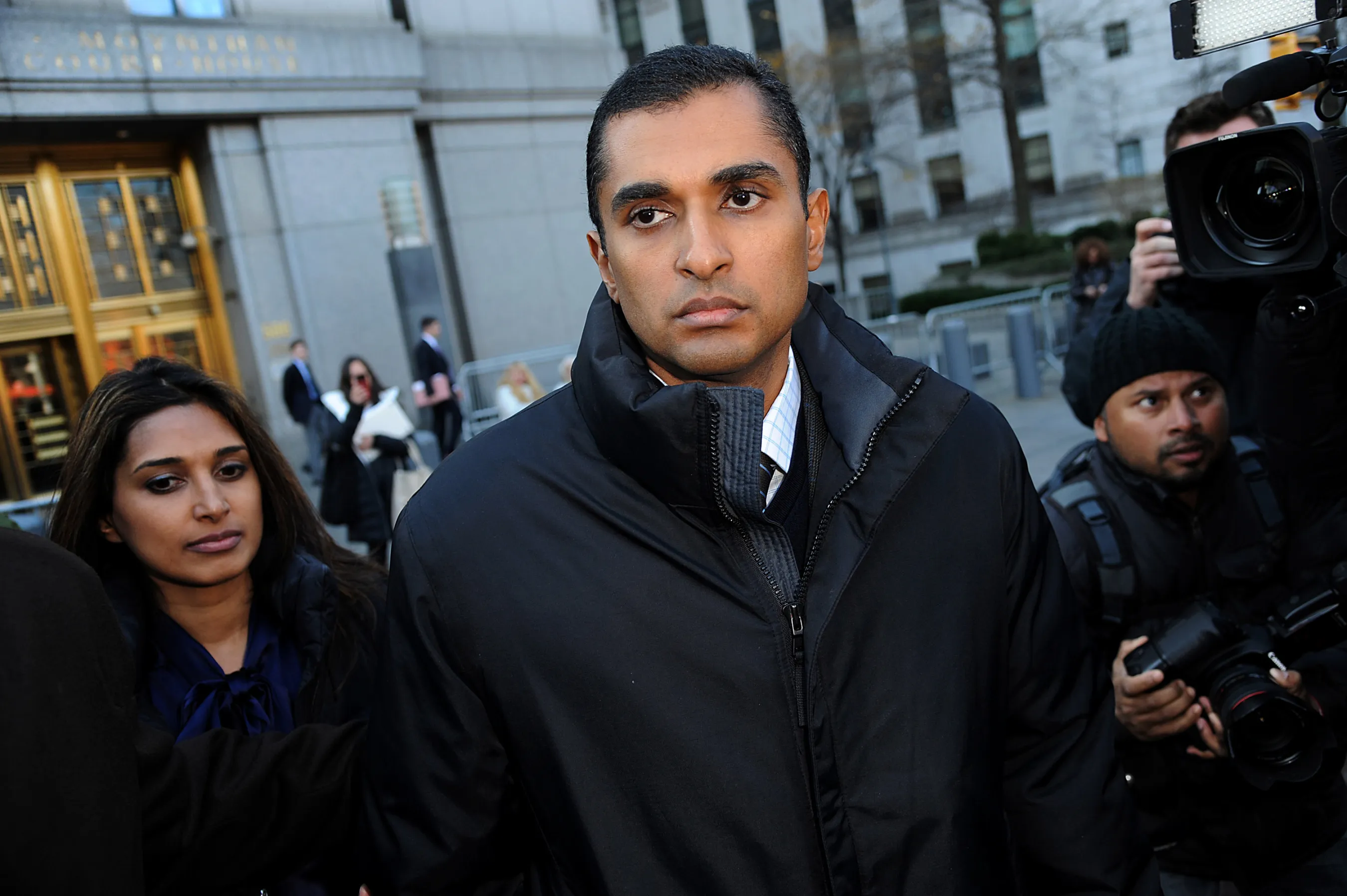 Mathew Martoma, a former portfolio manager at a unit of SAC Capital Advisors LP, center, exits federal court in New York, on Nov. 26, 2012.
