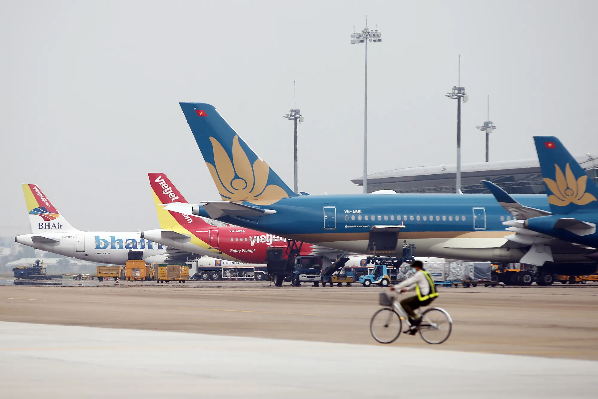 A&nbsp;Vietnam Airlines JSC aircraft, right, near&nbsp;Ho Chi Minh City.