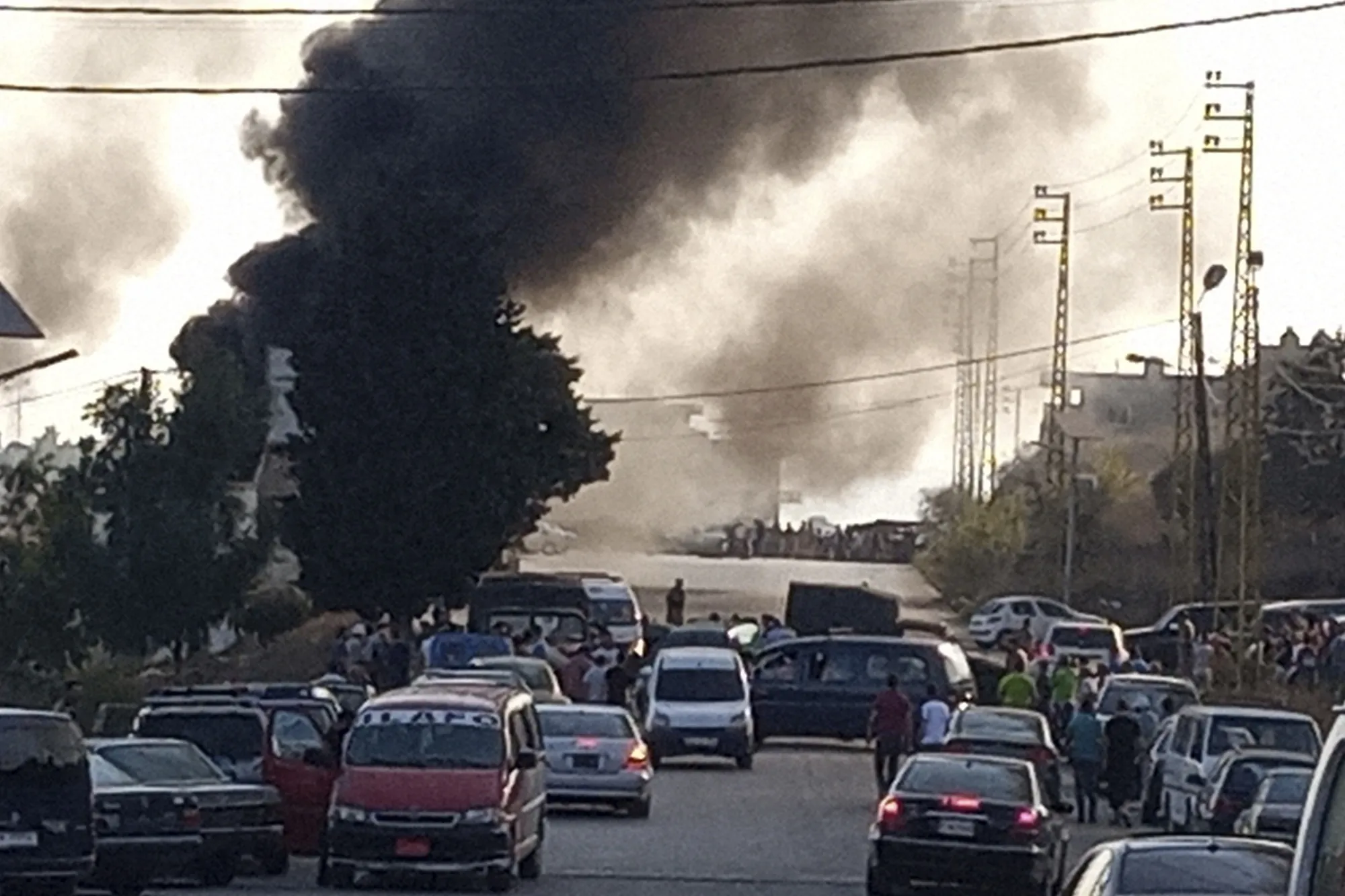 Smoke rises from the scene where a fuel tanker exploded, in north Lebanon, on&nbsp;Aug. 15.