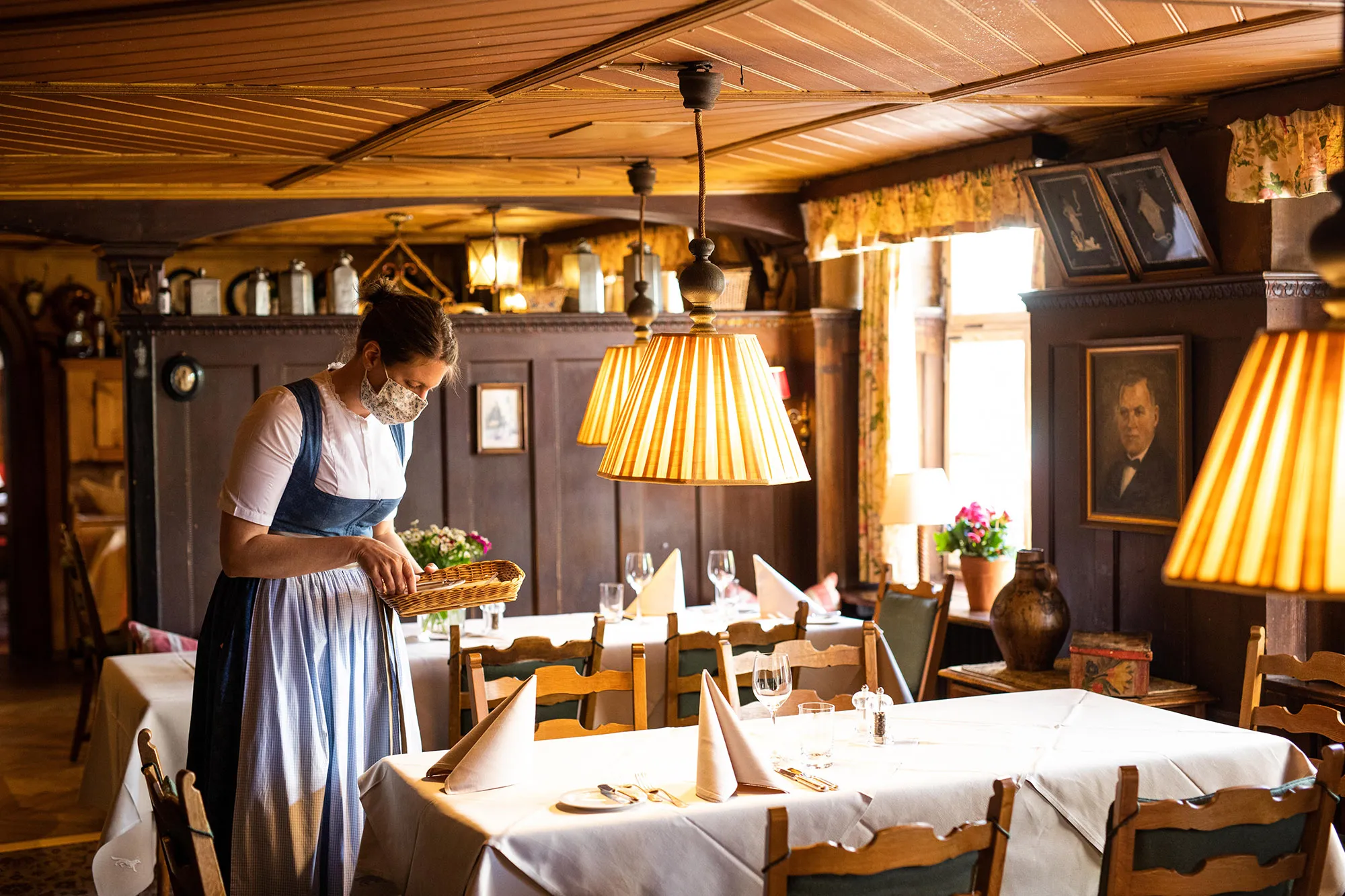 Staff&nbsp;set tables in a&nbsp;hotel restaurant as they&nbsp;may reopen for guests in Baden-Wuerttemberg, on May 18.&nbsp;
