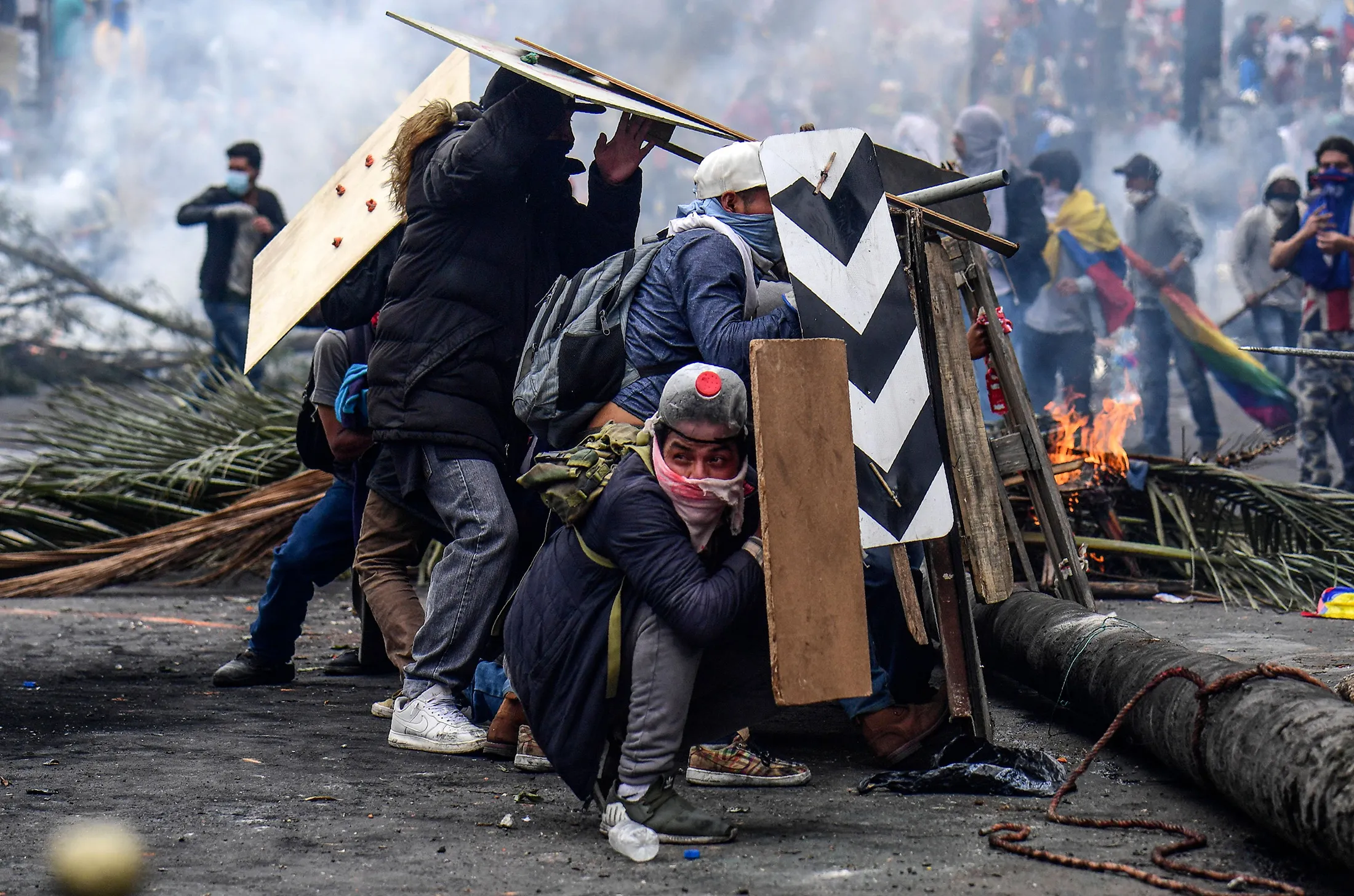 Demonstrators clash with riot police during a protest over a fuel price hike ordered by the government to secure an IMF loan, in Quito on Oct.&nbsp;11.