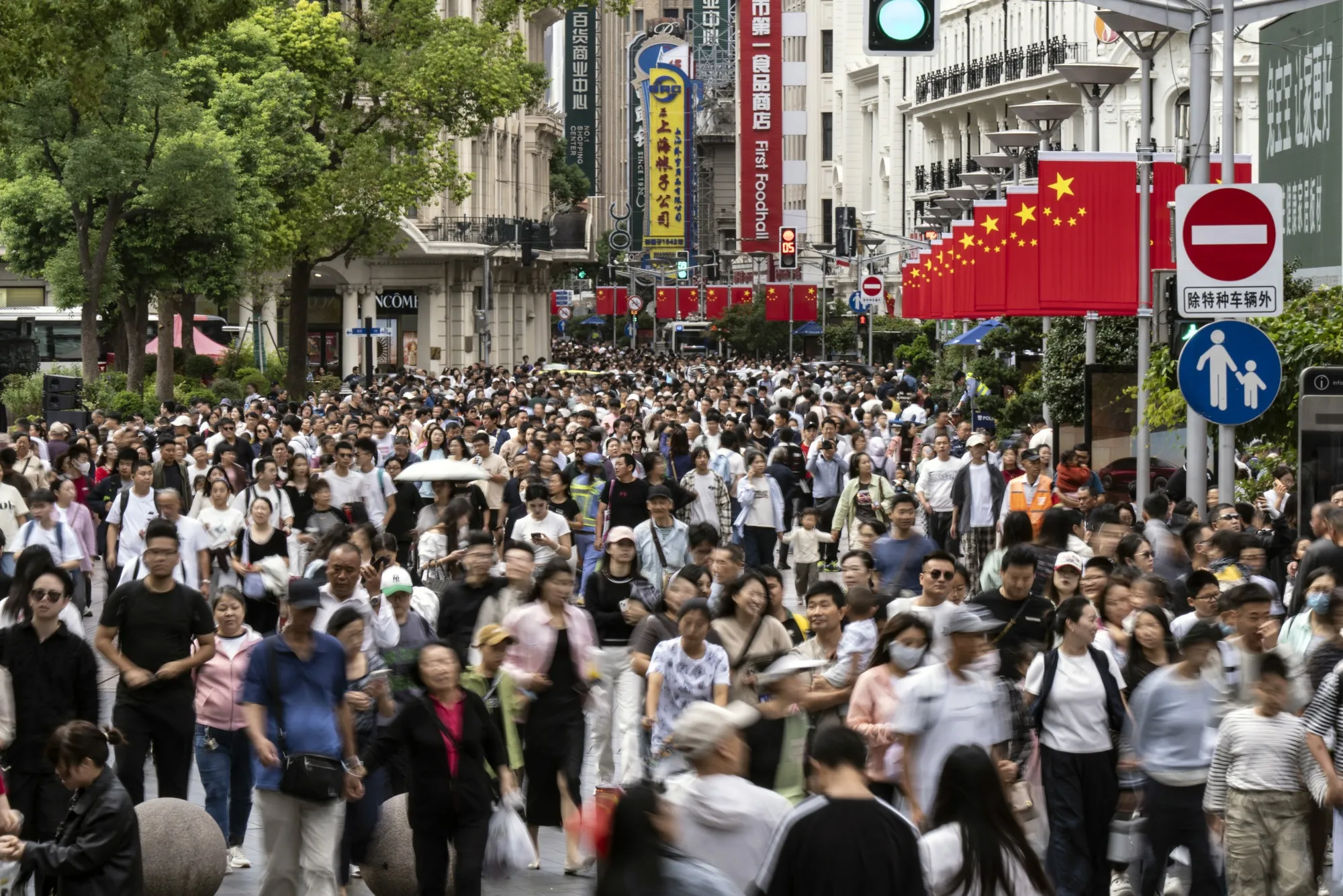 Shoppers on Nanjing East Road in Shanghai.