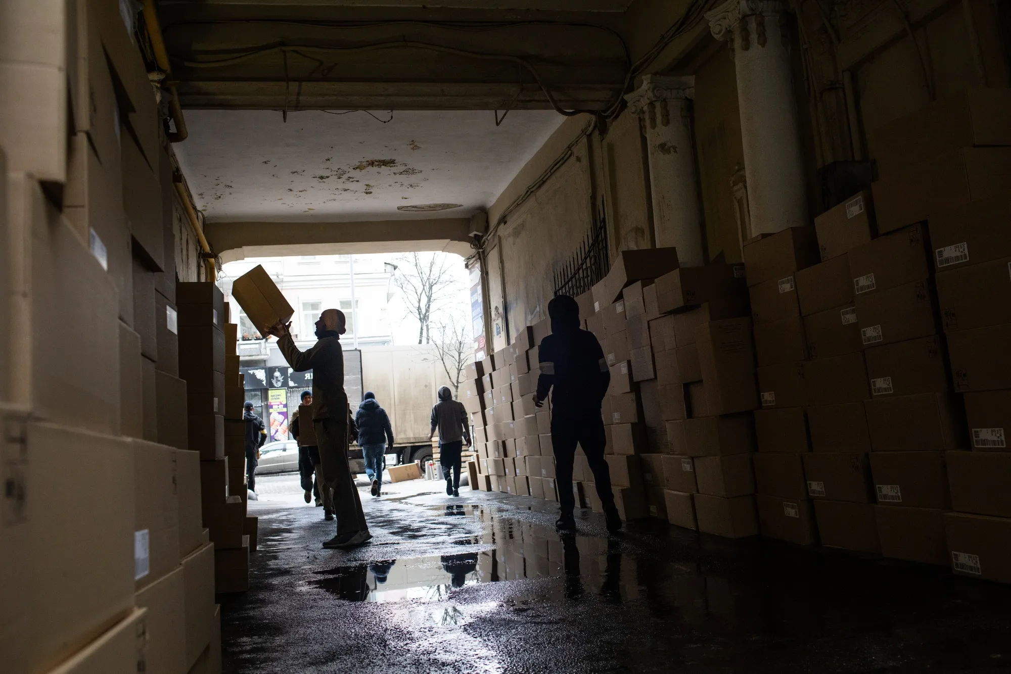 Volunteers unload donated supplies from a truck at a depot of Ukraine's Territorial Defense in Kyiv, Ukraine, on March 1.