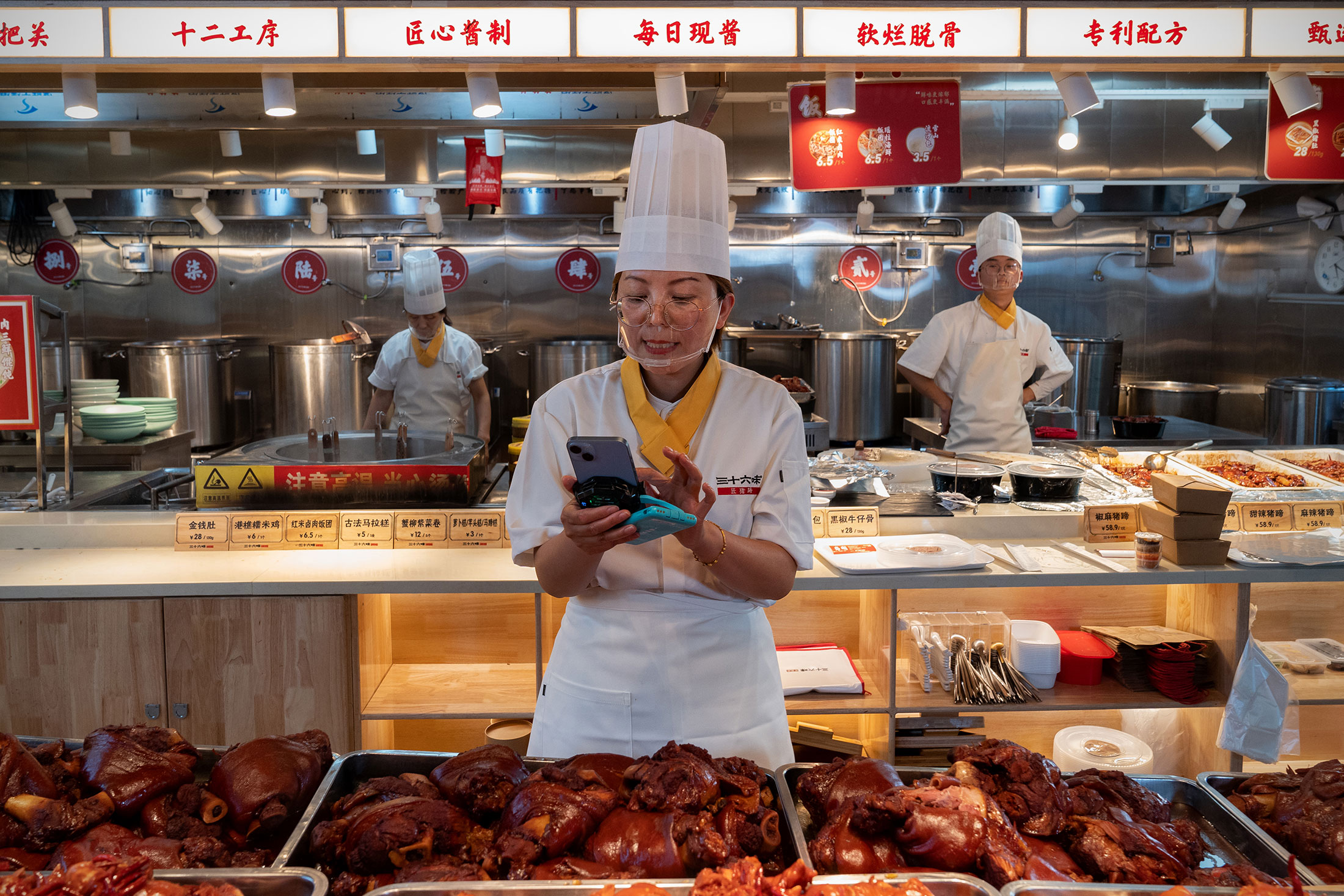 Zhou livestreaming on Douyin from her restaurant.