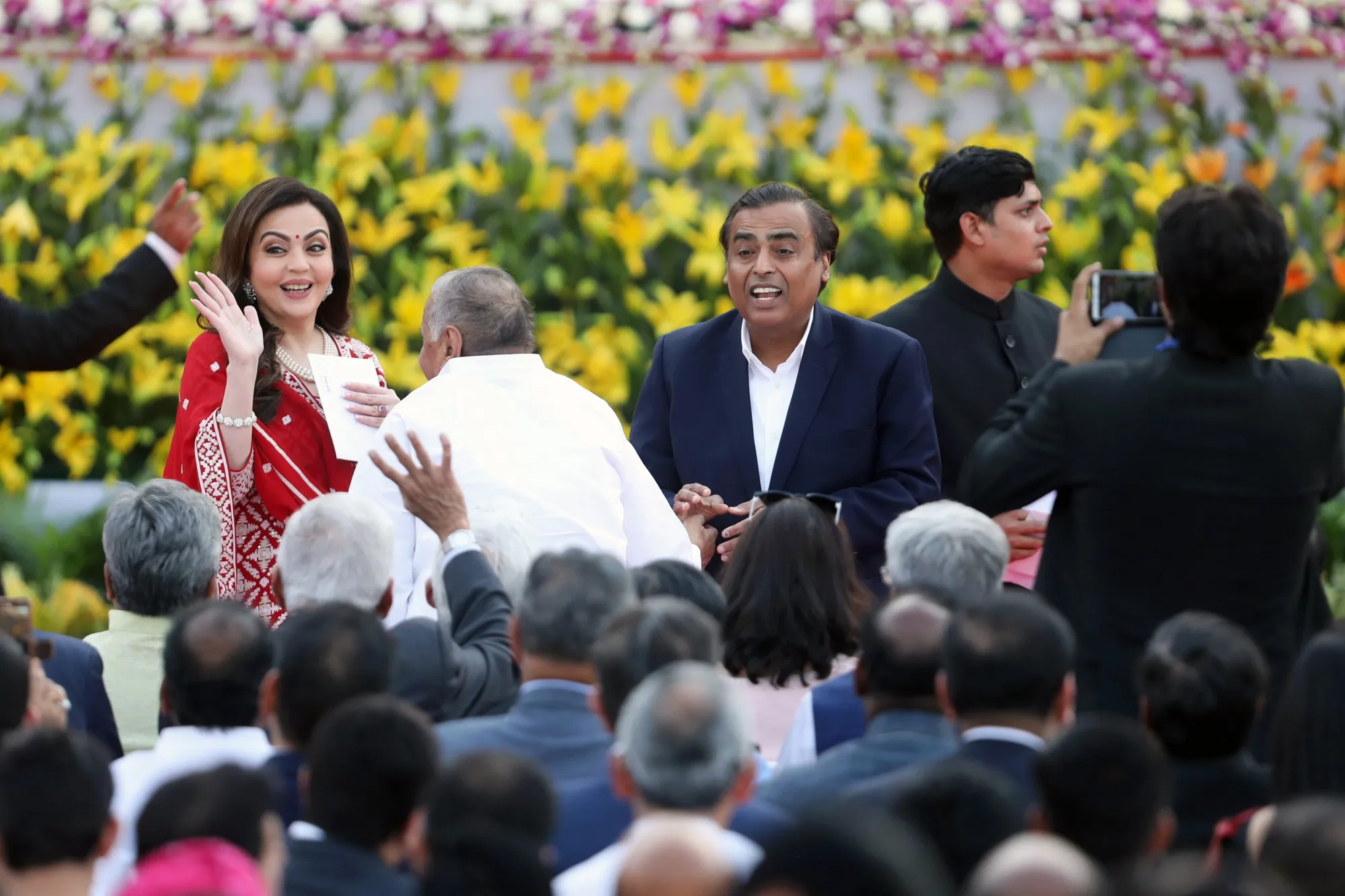 Nita Ambani, left, with Mukesh Ambani.