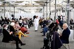 People wait after receiving Covid-19 vaccinations in Copenhagen on April 12.