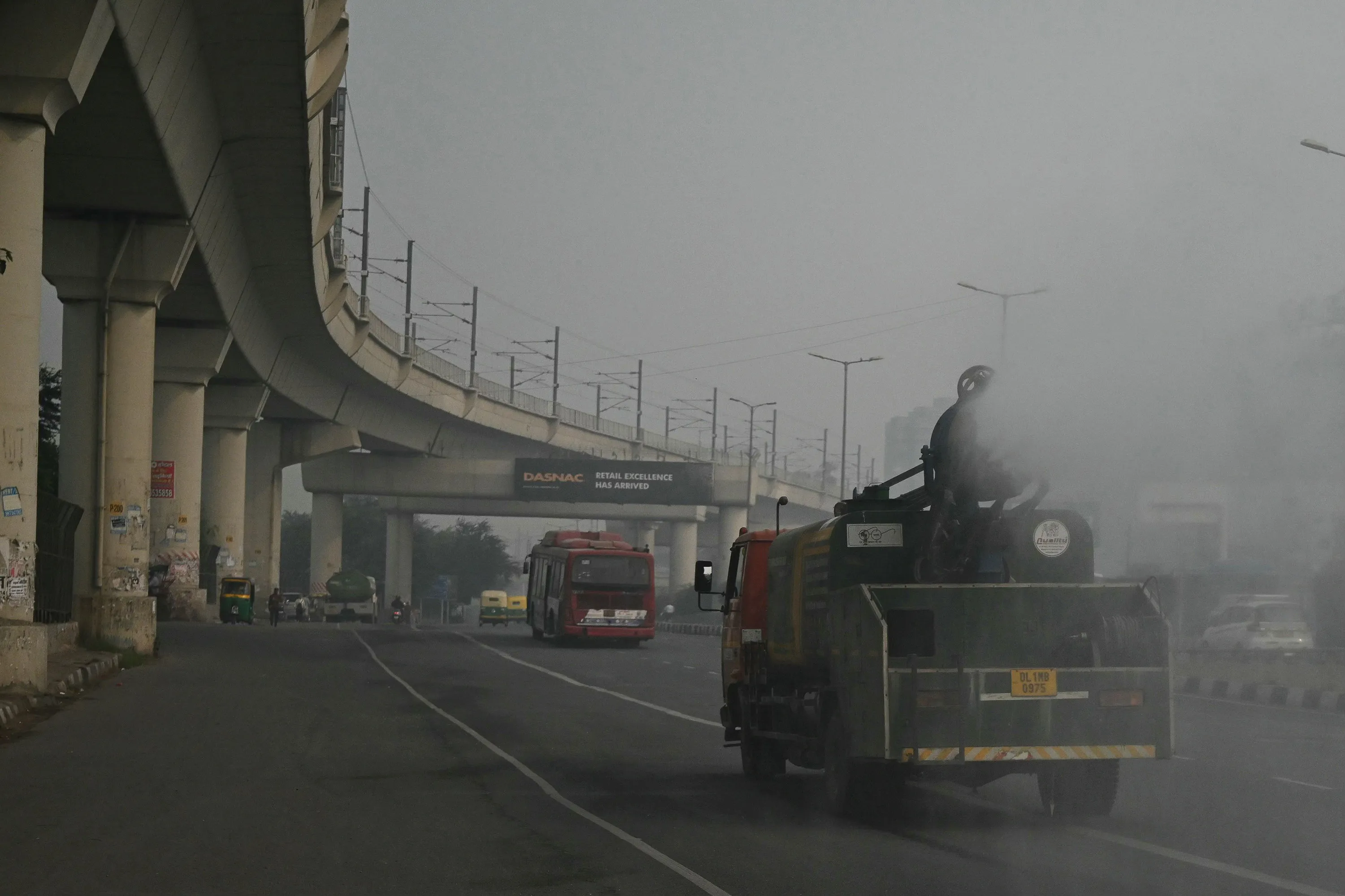 Civic authorities use a vehicle with an anti-smog gun amid heavy smog conditions in New Delhi on Nov. 9.