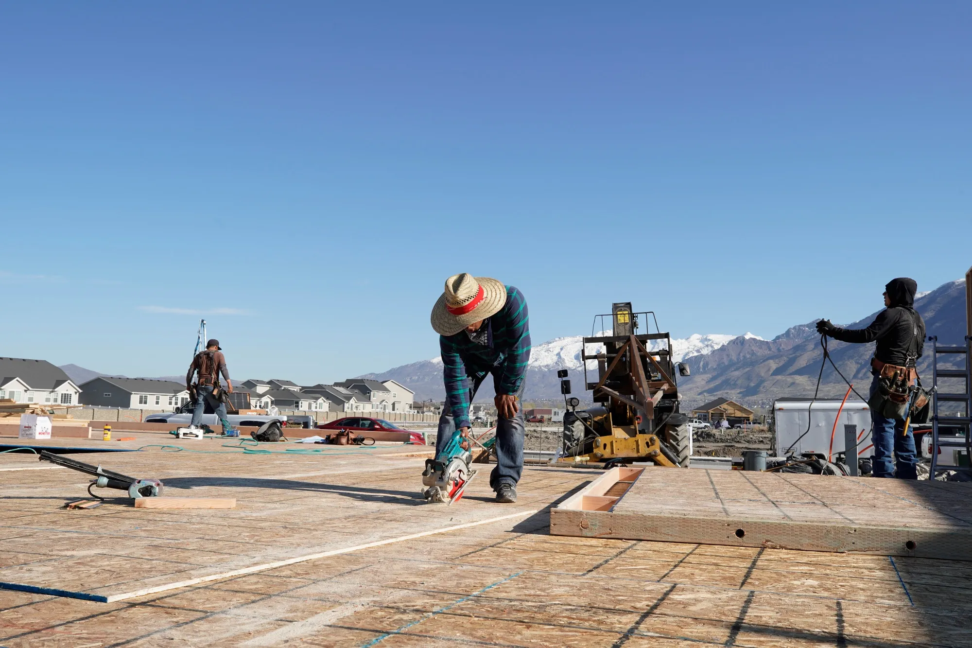 A contractor cuts lumber during the construction of a home in Lindon, Utah, on April 8.