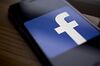 The Facebook Inc. logo is displayed for a photograph on an Apple Inc. iPhone in Washington, D.C., U.S., on Wednesday, March 21, 2018. Facebook is struggling to respond to growing demands from Washington to explain how the personal data of millions of its users could be exploited by a consulting firm that helped Donald Trump win the presidency.