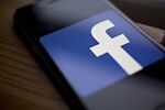 The Facebook Inc. logo is displayed for a photograph on an Apple Inc. iPhone in Washington, D.C., U.S., on Wednesday, March 21, 2018. Facebook is struggling to respond to growing demands from Washington to explain how the personal data of millions of its users could be exploited by a consulting firm that helped Donald Trump win the presidency.
