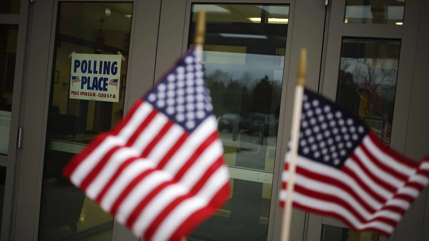 A "Polling Place" sign is displayed at a polling station in the Kentucky National Guard Readiness Center in Burlington, Kentucky, U.S., on Tuesday Nov. 4, 2014.
