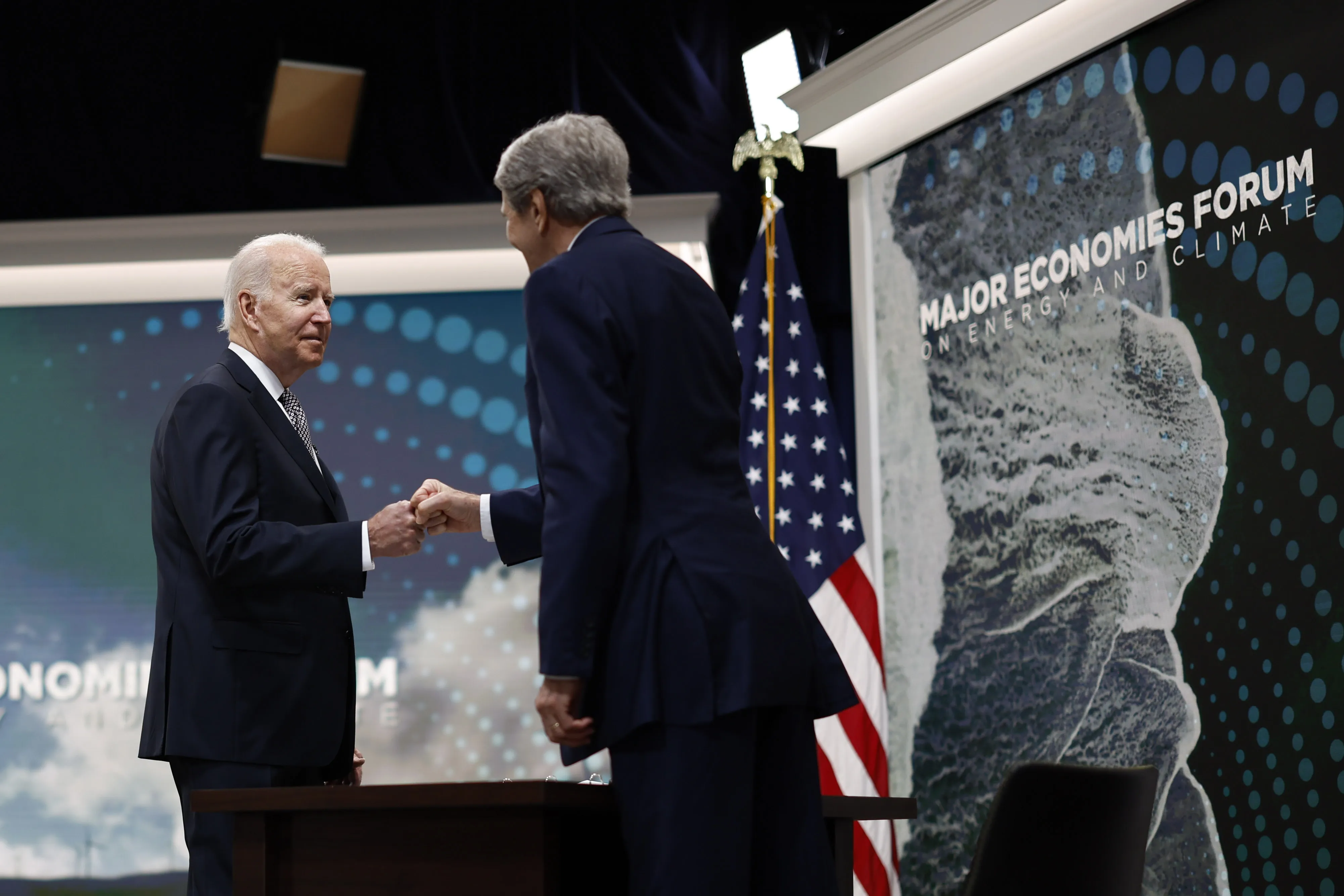 Joe Biden greets John Kerry during the virtual Major Economies Forum on Energy and Climate in Washington, on June 17.