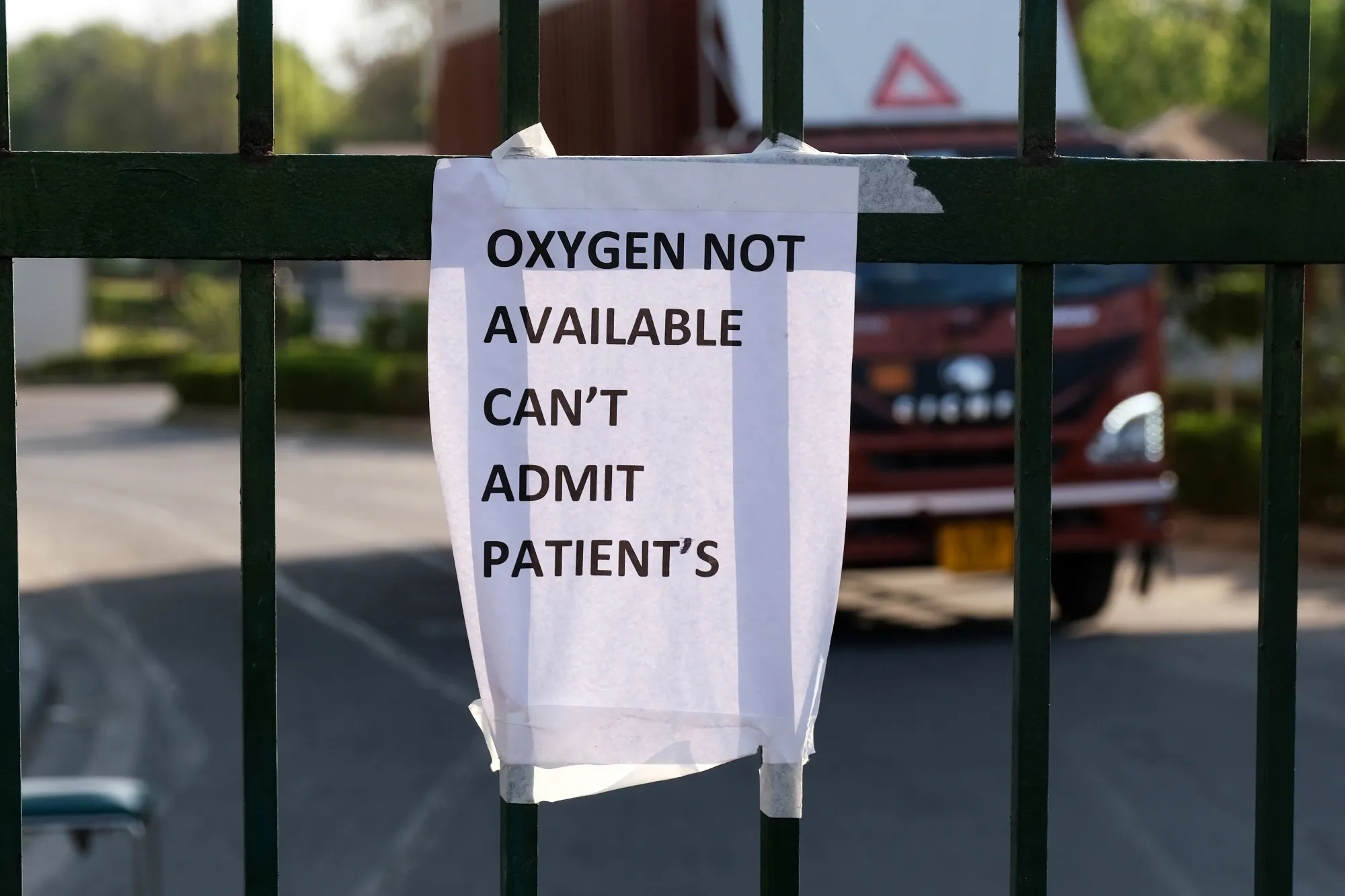 A notice on a gate indicates there is no oxygen at the Covid-19 Care Center set up at the Commonwealth Games Village Sports Complex in New Delhi on&nbsp;April 25