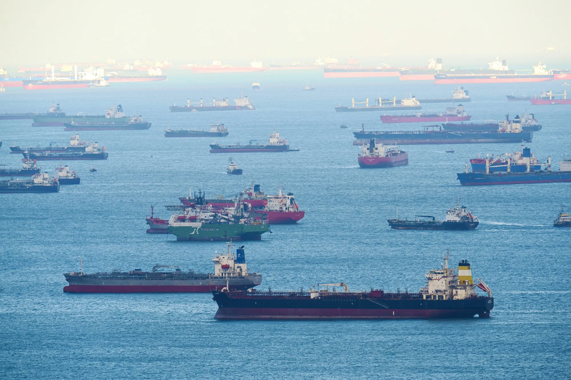 Cargo ships, oil tankers and other vessels at anchor off Singapore.