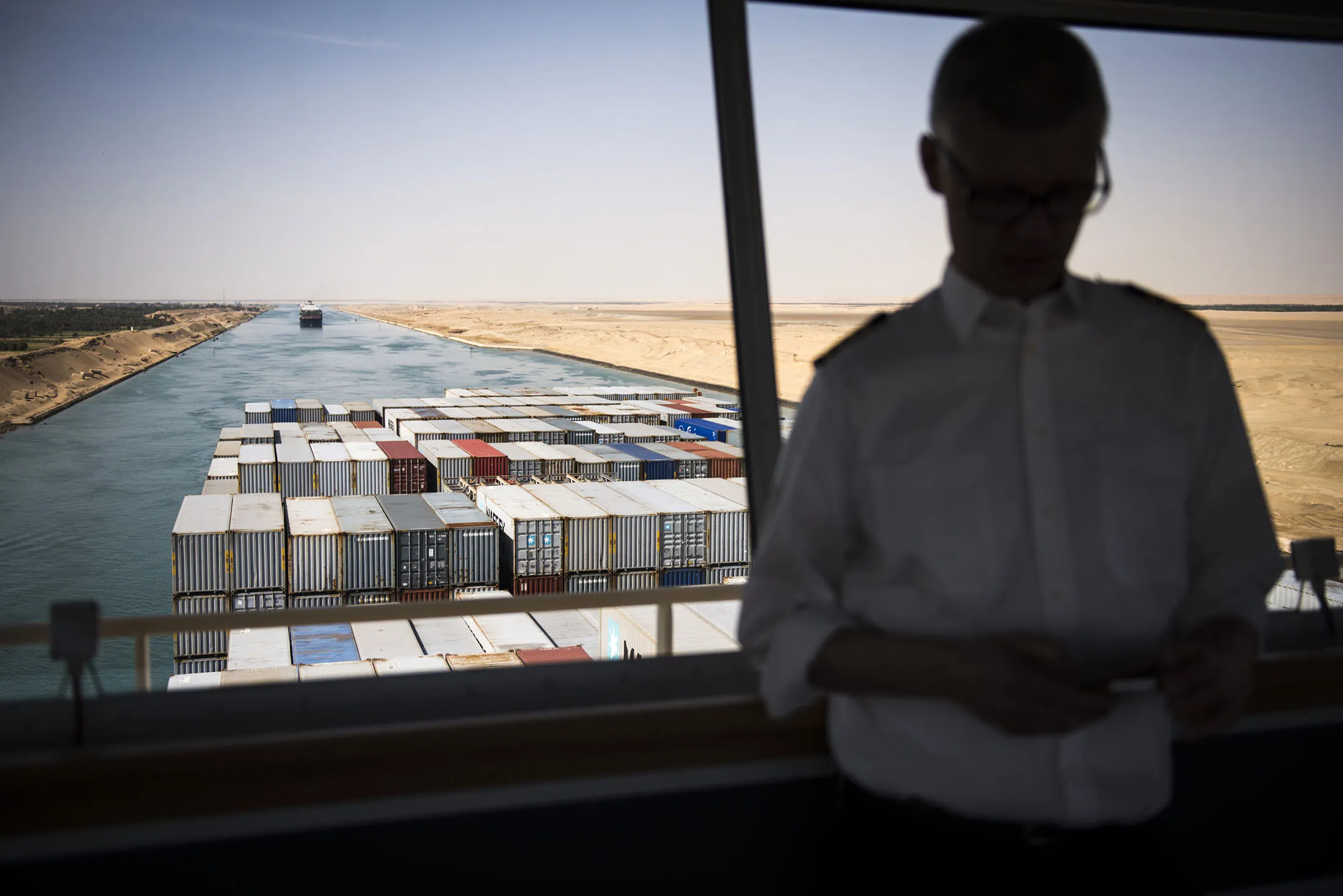 Shipping containers are seen from the navigation bridge aboard a ship during its southbound passage along the Suez Canal in Egypt.
