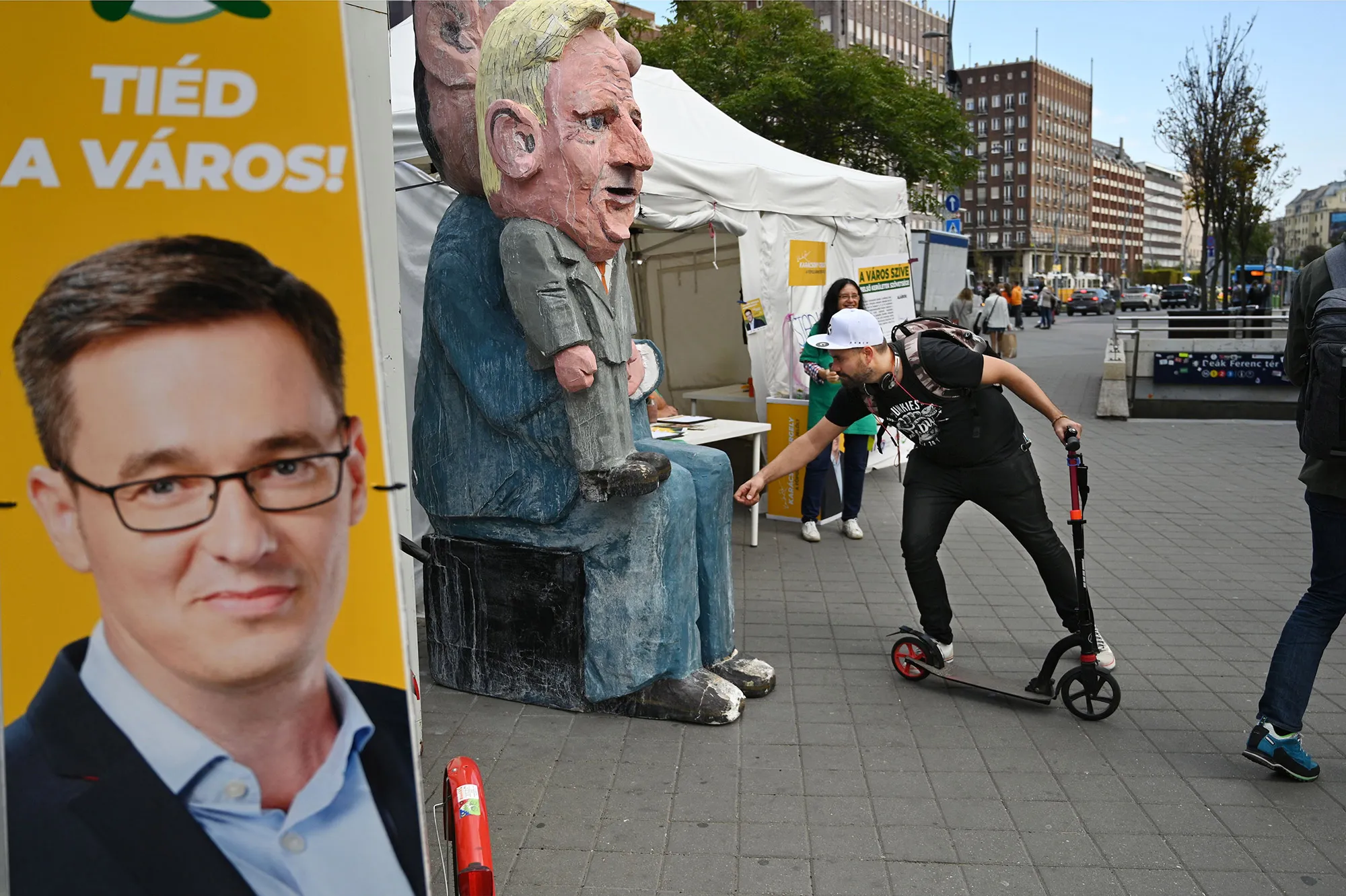A campaign board for Gergely Karacsony, left, and&nbsp;a satirical&nbsp;statues&nbsp;of Istvan Tarlos&nbsp;in Budapest.&nbsp;