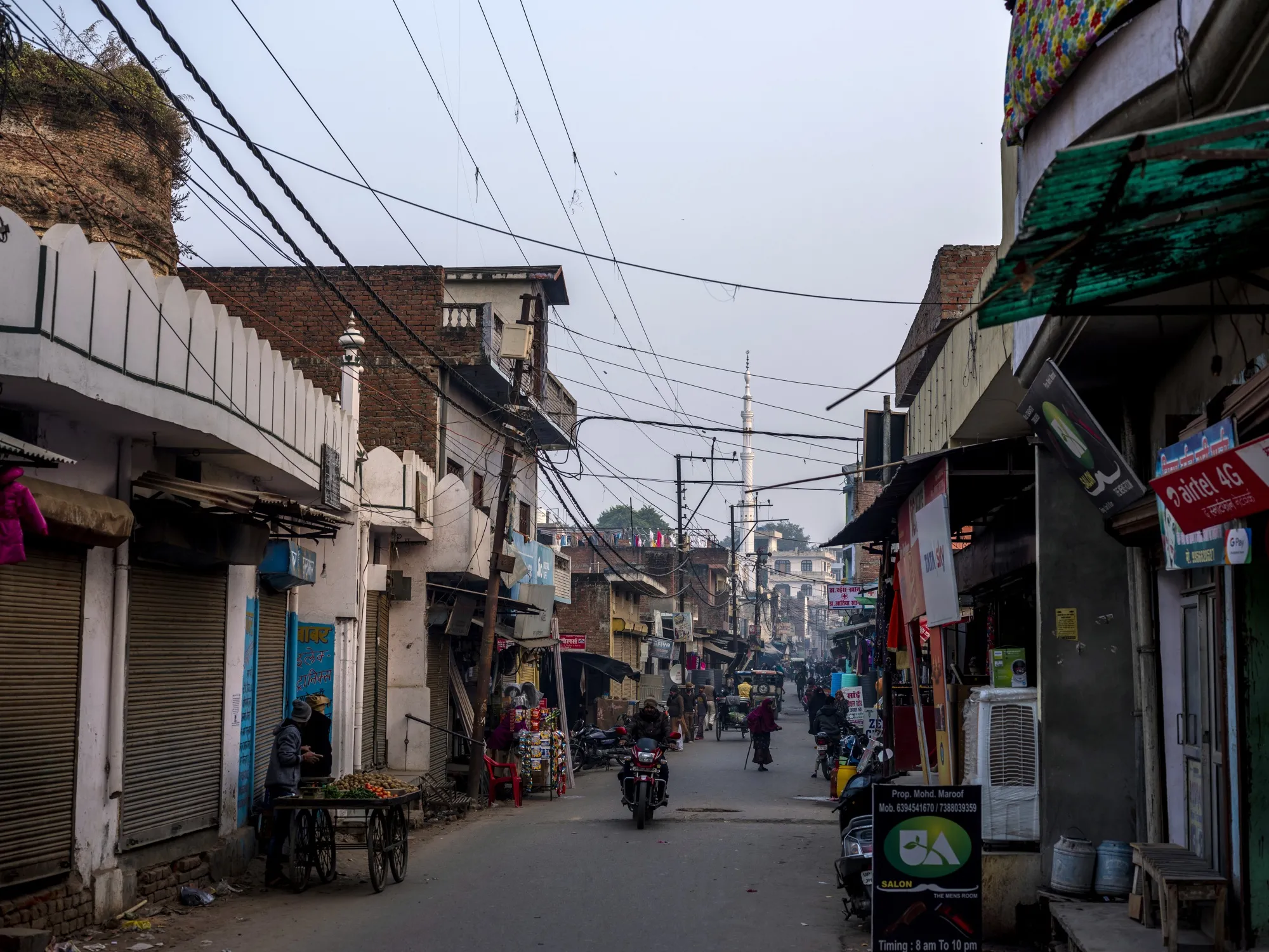 A motorcyclist rides along a road in Lucknow, Uttar Pradesh.