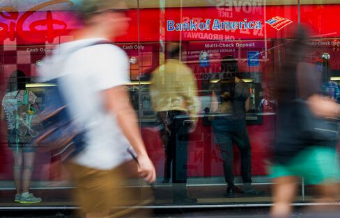 Customers use ATMs at a Bank of America branch