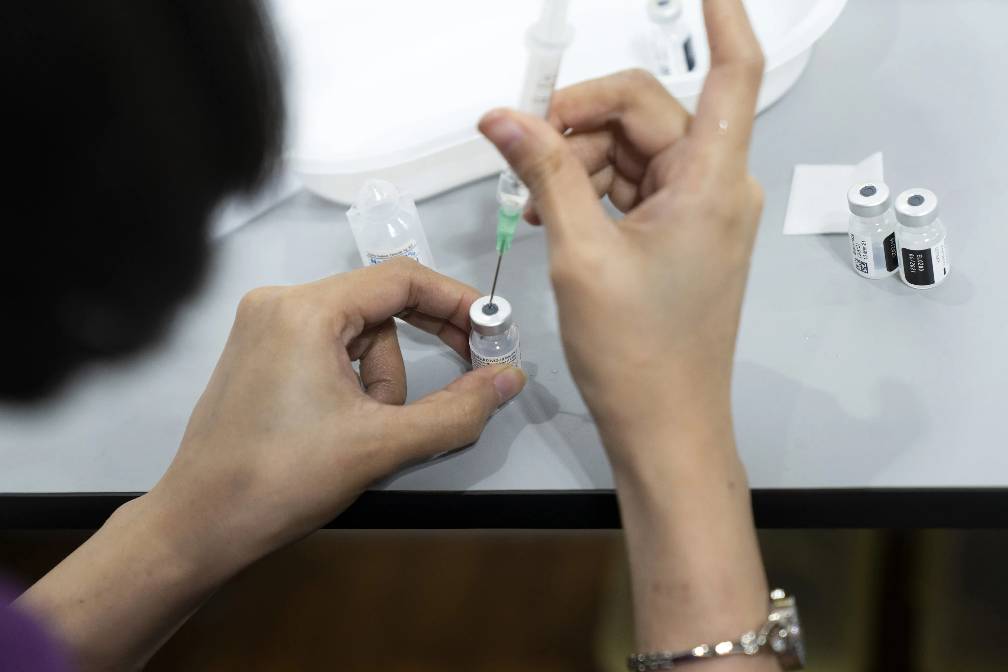 Inoculating Seniors at a Vaccination Center as Singapore is Prioritizing Safely Reopening Its Borders